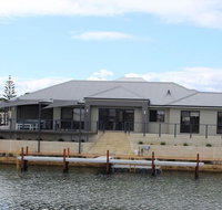 Port Bouvard Retreat - Large Family Friendly Canal Home with Private Jetty - Accommodation in Surfers Paradise